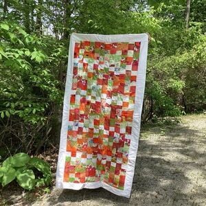 New With Tags.  Bright Summer Orange and Green Garden Coin Lap Quilt